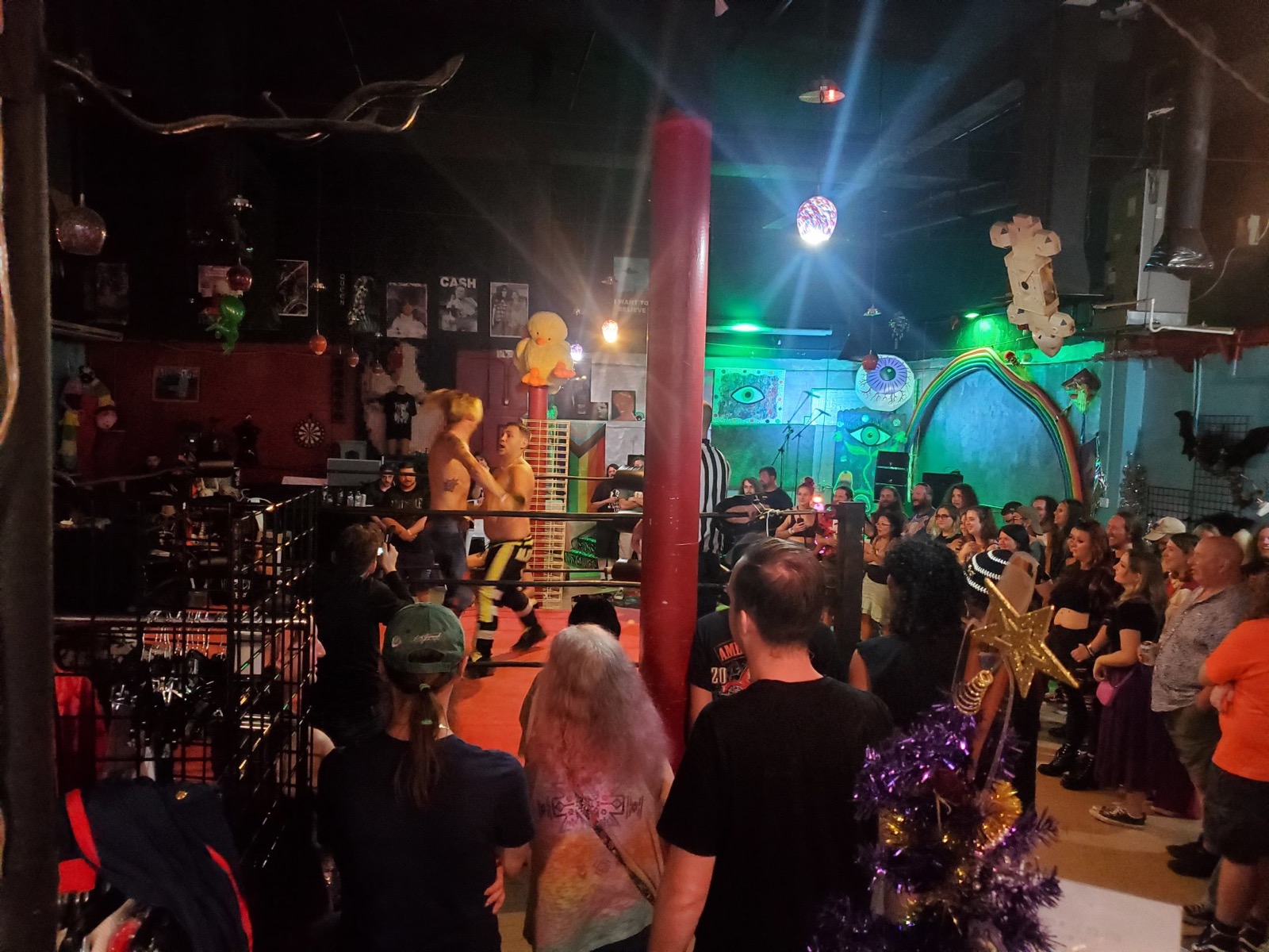 Wrestling ring match drawing a full crowd