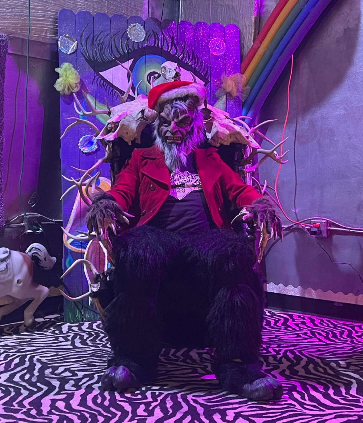Krampus costume on the zebra-print stage